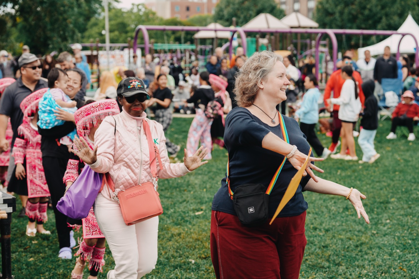Madison's Mayor dancing joyfully with community members at the Good Neighbor Gathering
